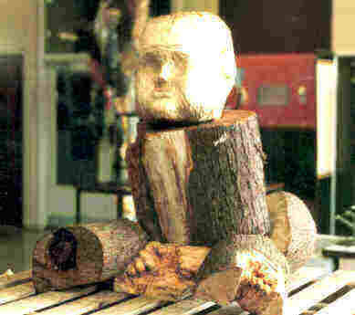Carved tree-trunk image of a baby 11.5k